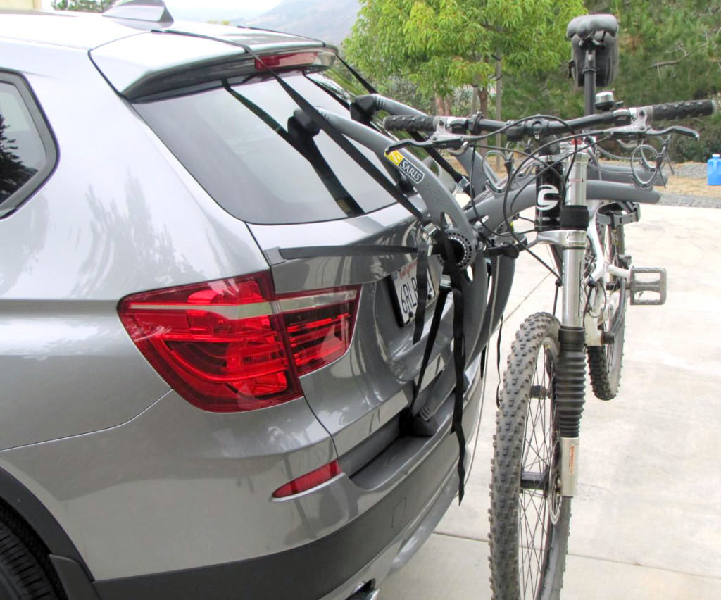 silver bmw x3 with a bike rack fitted carrying a bike