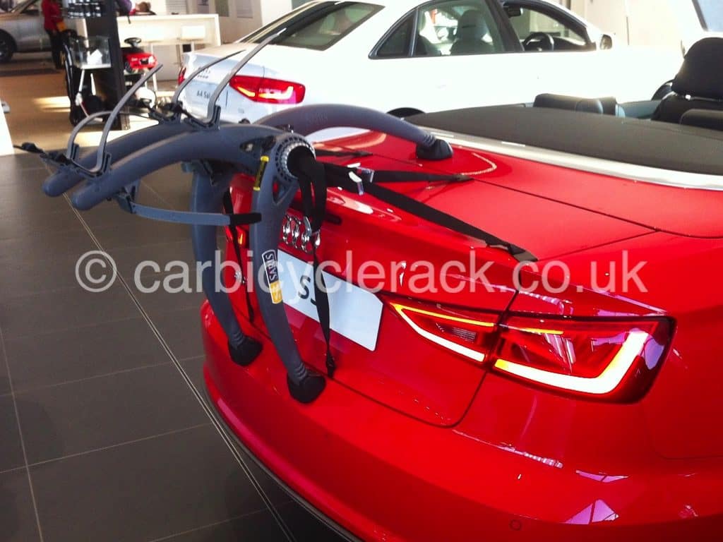 Audi A5 Coupe Bike Rack fitted to a red a3 cabriolet in an audi shworoom