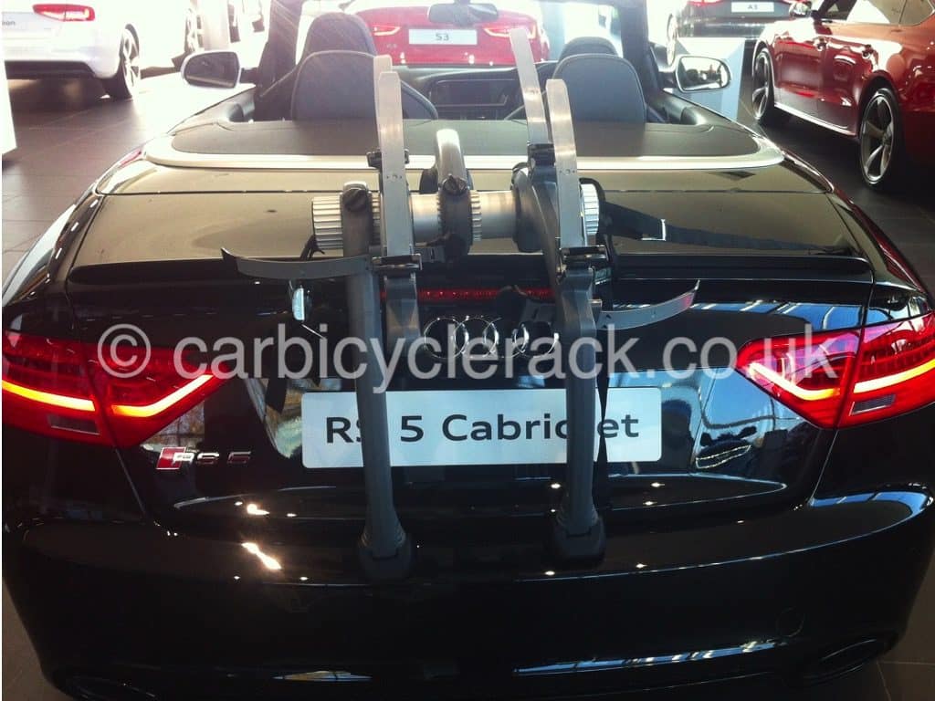 Audi A4 Cabriolet Bike Rack fitted to a black audi a5 cabriolet in an audi showroom